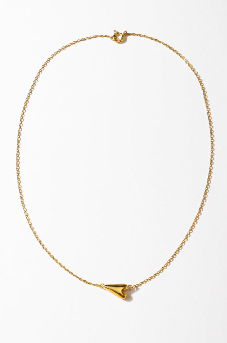 A simple heart-shaped necklace with a silver chain and a heart pendant, displayed against a white background.